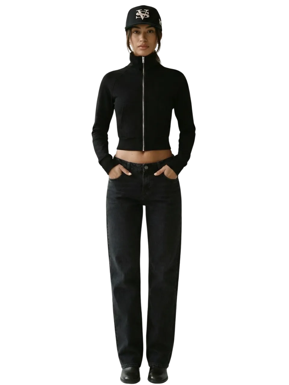 Model in an all-black zip jacket, black jeans and cap