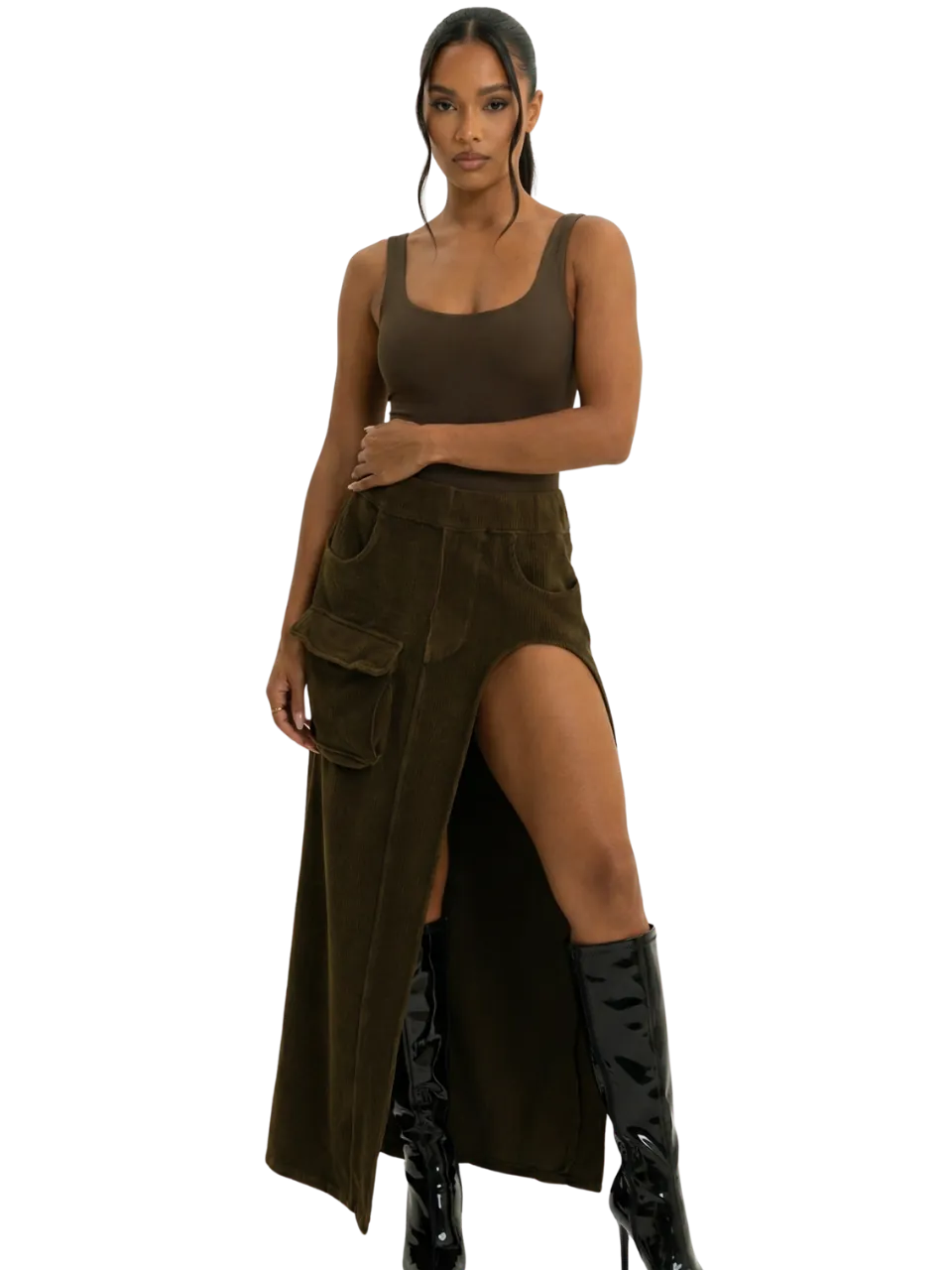 Model in a brown knit top and suede maxi skirt with knee-high boots